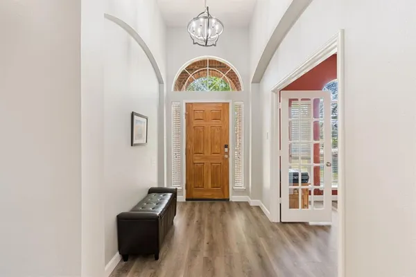 a view of an entryway with wooden floor