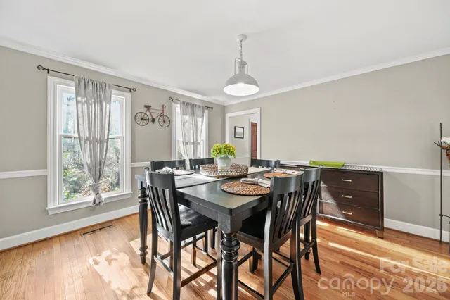 a view of a dining room with furniture and window