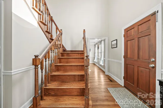 a view of washer and dryer with bathroom in the background