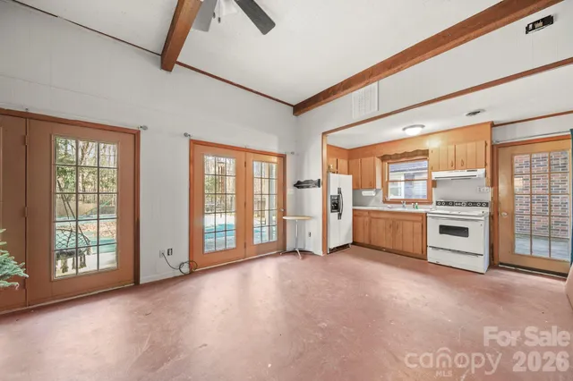 a kitchen with a refrigerator stove and sink