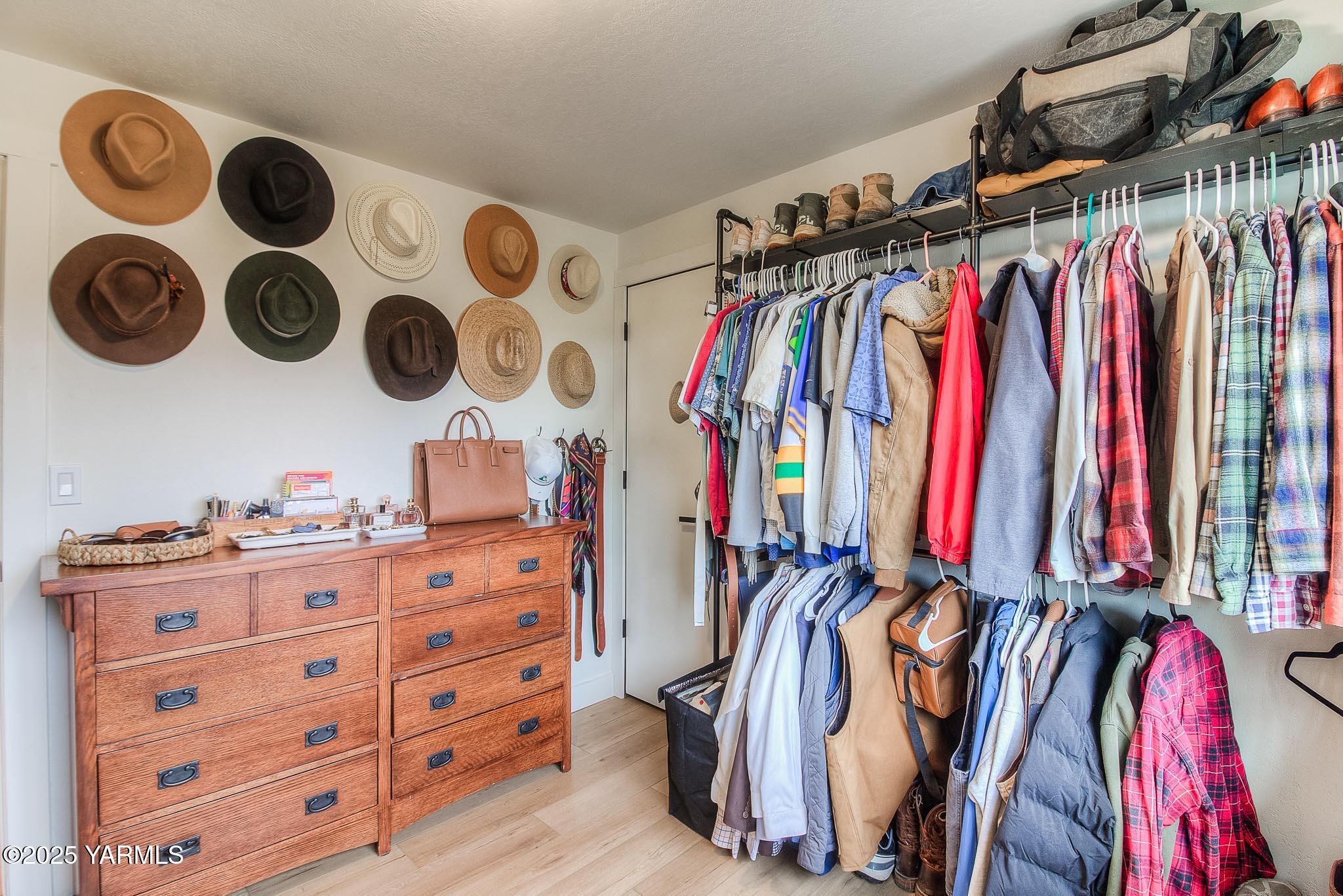 240 Knoll Road Yakima, WA 98908 - Photo 17 of 47 a view of walk in closet with clothes and shoes
