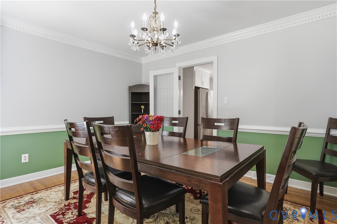 12512 2nd Branch Road Chesterfield, VA 23838 - Photo 19 of 56 a view of a dining room with furniture and chandelier