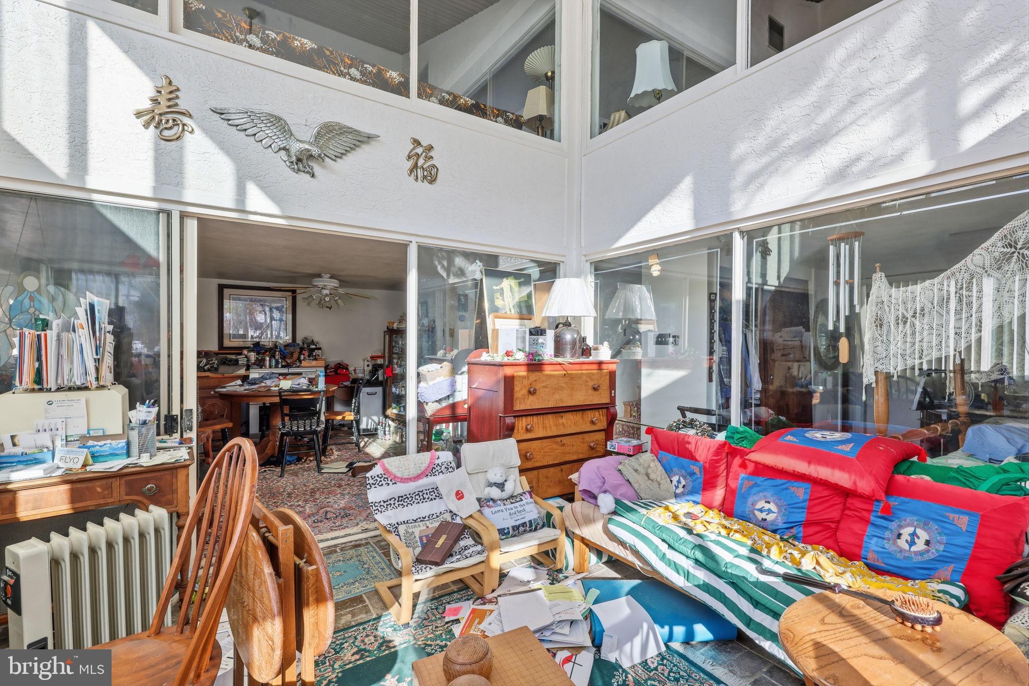 24 Old Limekiln Road Doylestown, PA 18901 - Photo 12 of 33 a living room filled with lots of furniture and a chandelier