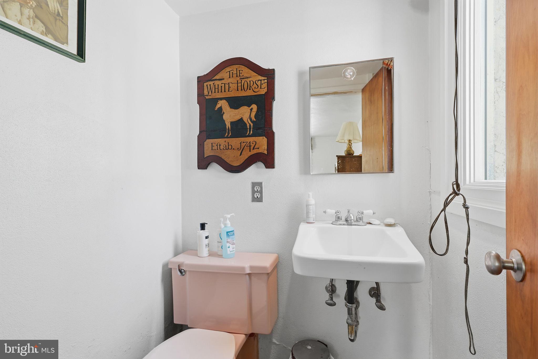 24 Old Limekiln Road Doylestown, PA 18901 - Photo 18 of 33 a bathroom with a sink mirror and toilet