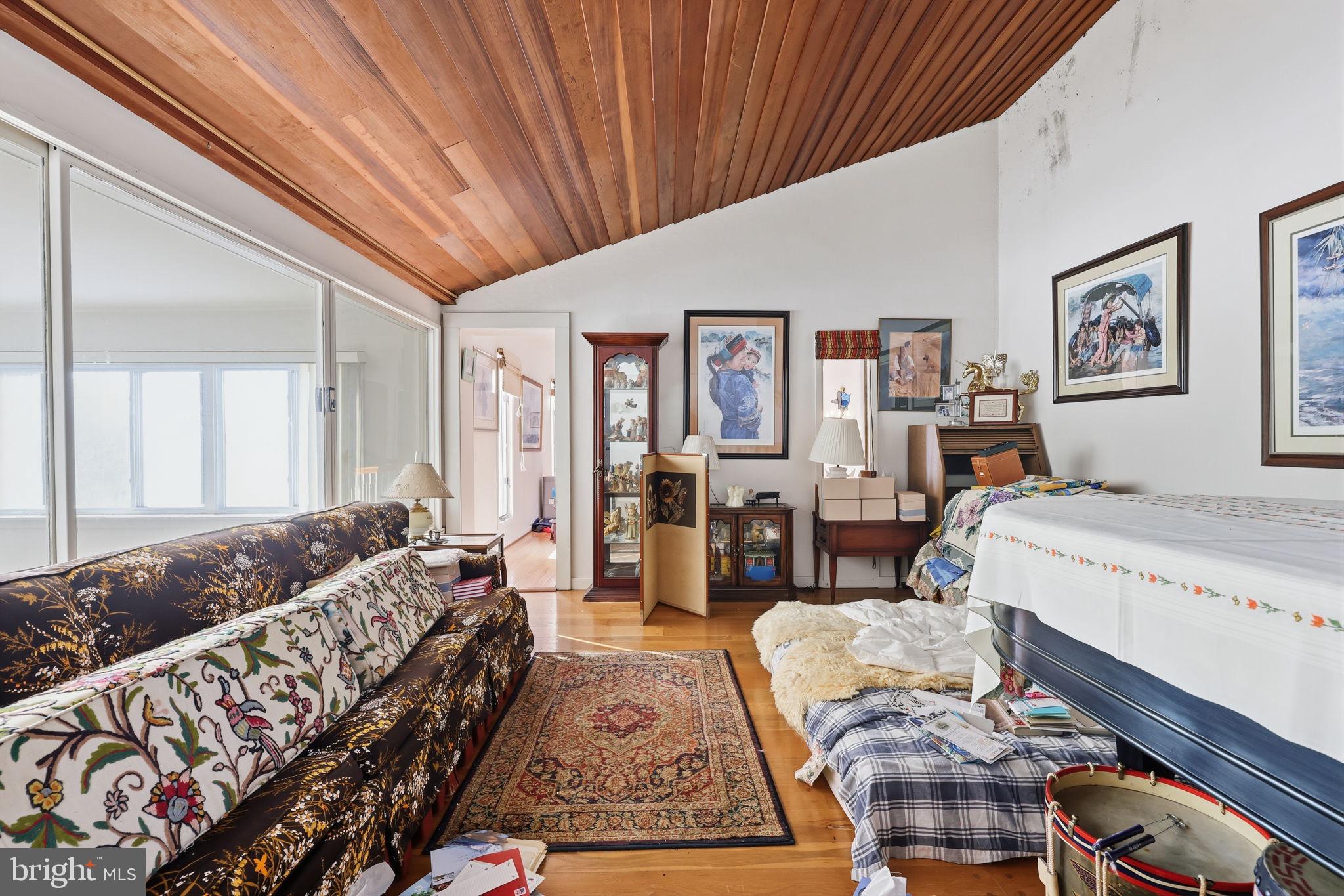 24 Old Limekiln Road Doylestown, PA 18901 - Photo 27 of 33 a spacious bedroom with a large bed couch and a window