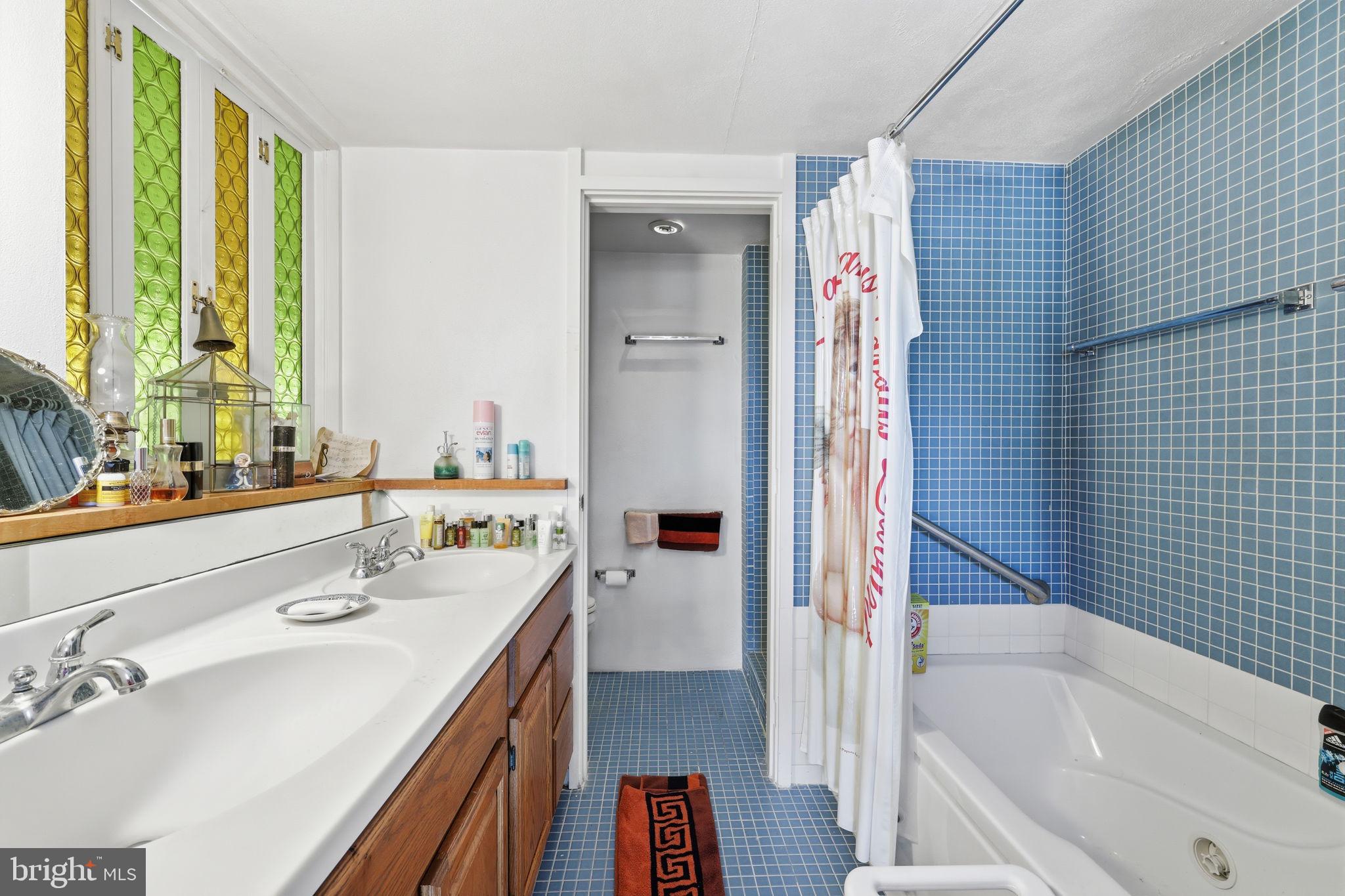 24 Old Limekiln Road Doylestown, PA 18901 - Photo 30 of 33 a bathroom with a tub sink and mirror