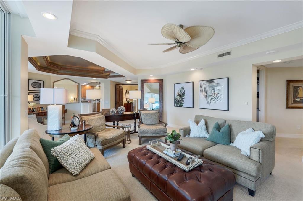 295 Grande Way, Unit T05 Naples, FL 34110 - Photo 3 of 49 a living room with furniture and a large window