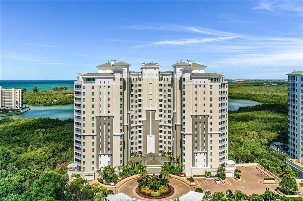 295 Grande Way, Unit T05 Naples, FL 34110 - Photo 46 of 49 a view of a city with tall buildings