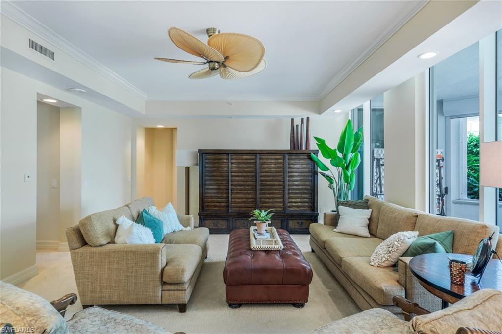 295 Grande Way, Unit T05 Naples, FL 34110 - Photo 6 of 49 a living room with furniture flowerpot and a potted plant