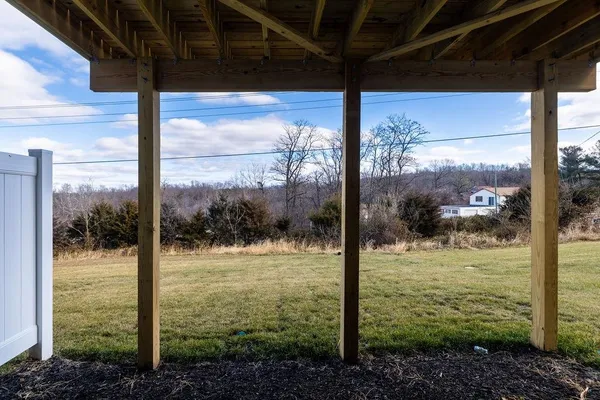 a view of deck with wooden floor and fence