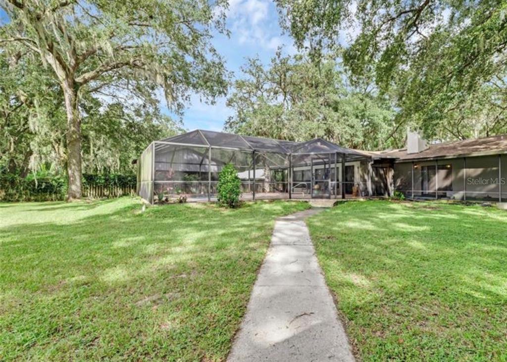 4308 Allen Road Fruitland Park, FL 34731 - Photo 33 of 33 a front view of a house with a yard table and chairs