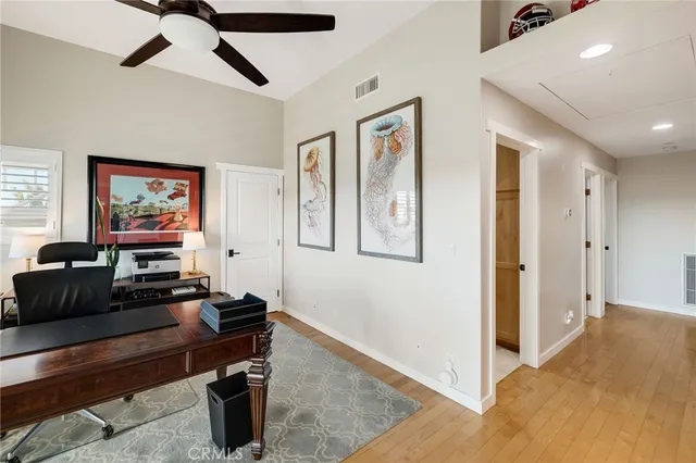 a spacious bedroom with a bed and a fireplace