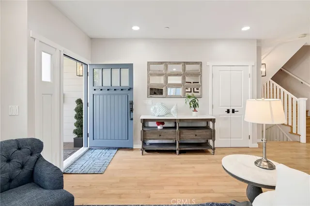 a bedroom with furniture and a wooden floor