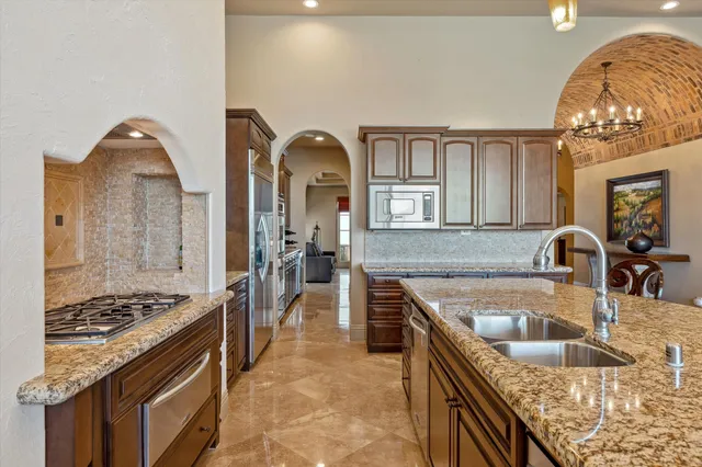 a bedroom with a bed and large glass window