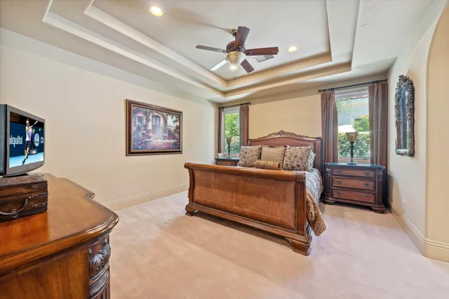 a bedroom with a bed dresser and a window