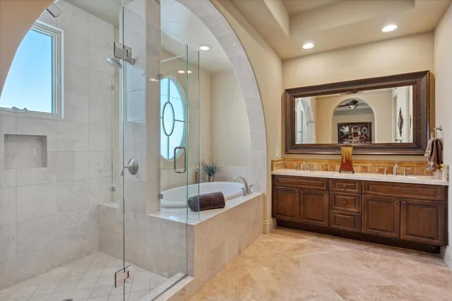 a bedroom with a bed and a tv