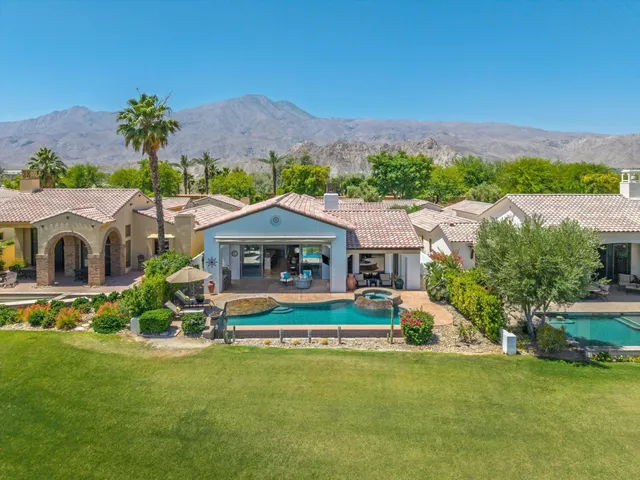a view of a swimming pool with a lounge chairs