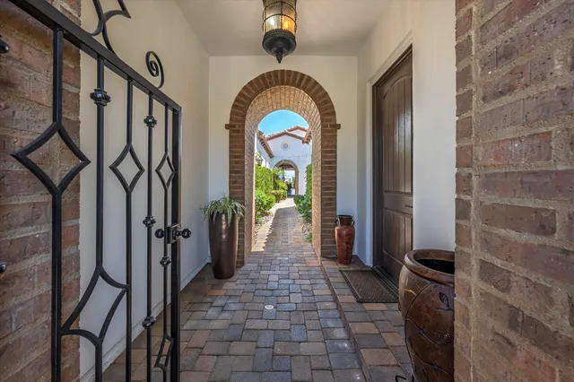 a living room with lots of furniture and a large window