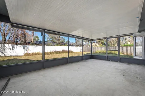 wooden floor and an empty room with large windows