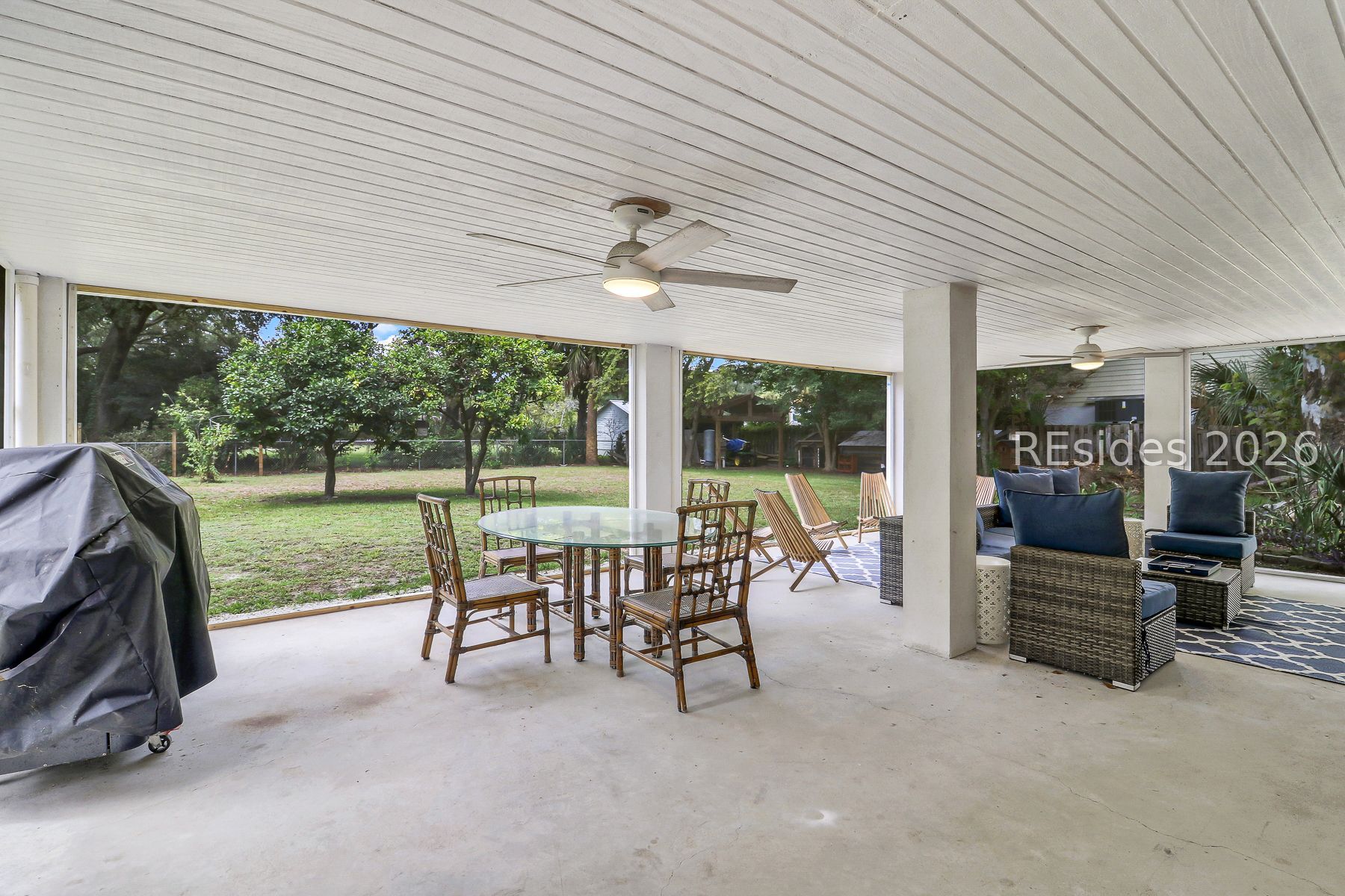 4 State Rd S-7-240 Bluffton, SC 29910 - Photo 45 of 58 screened porch with back yard view