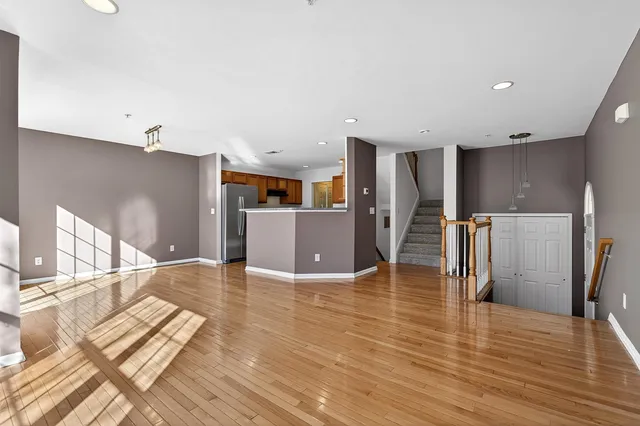 a kitchen with stainless steel appliances a refrigerator and a stove top oven