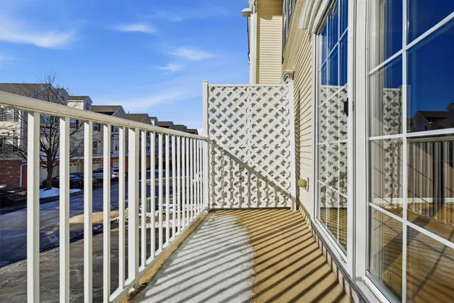 a view of a balcony with wooden floor