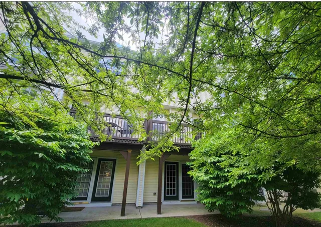 a sign that is on the side of a tree