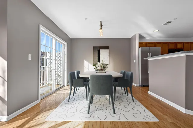 a view of a dining room with furniture window and wooden floor