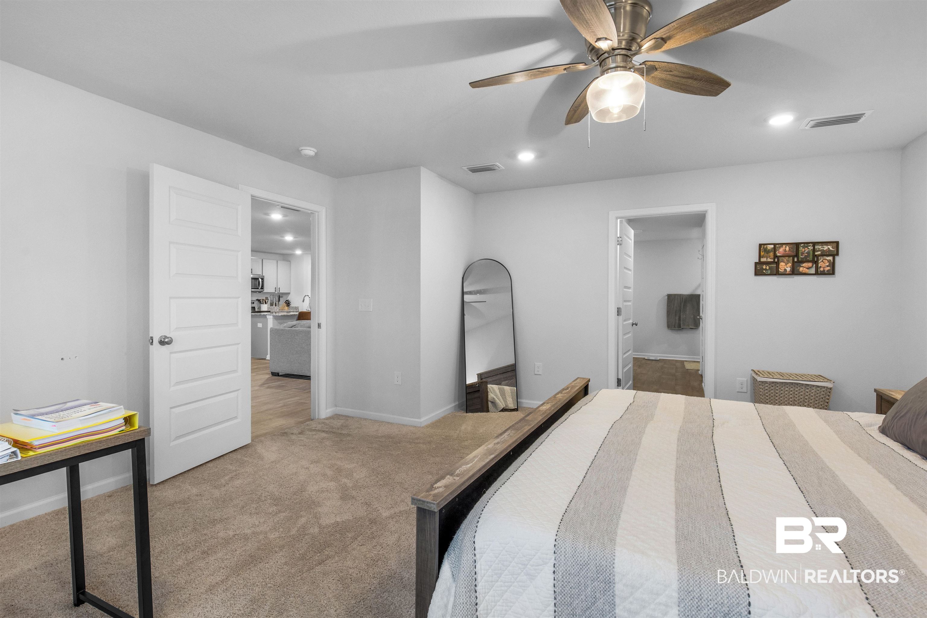 10313 Ruffian Route Daphne, AL 36526 - Photo 24 of 46 Bedroom with light colored carpet and ceiling fan