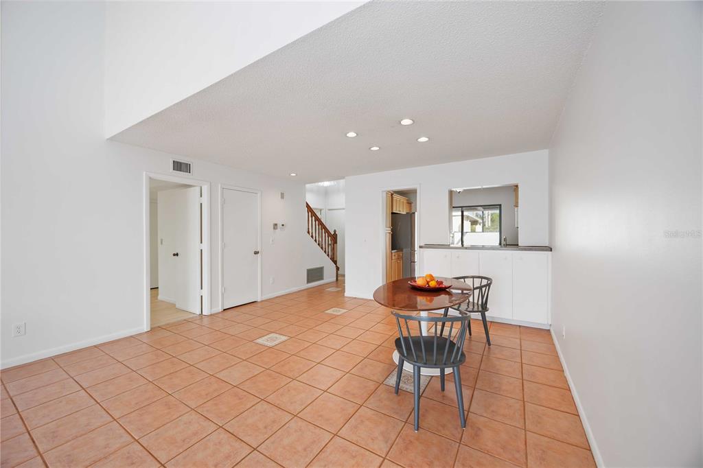 2767 Horseshoe Court, Unit Q3 Sarasota, FL 34235 - Photo 12 of 49 a workspace with furniture and wooden floor