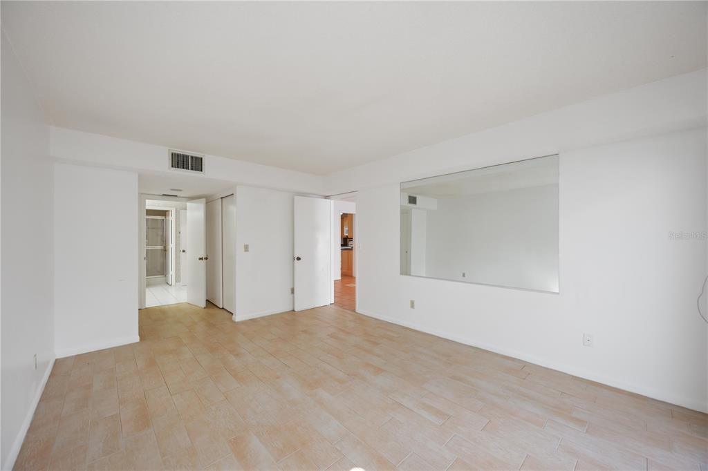 2767 Horseshoe Court, Unit Q3 Sarasota, FL 34235 - Photo 22 of 49 a view of an empty room with window