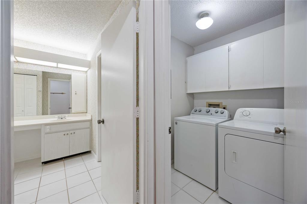 2767 Horseshoe Court, Unit Q3 Sarasota, FL 34235 - Photo 25 of 49 a view of utility room with closet and dryer