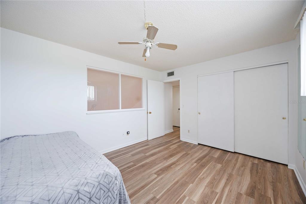 2767 Horseshoe Court, Unit Q3 Sarasota, FL 34235 - Photo 28 of 49 a view of empty room with wooden floor