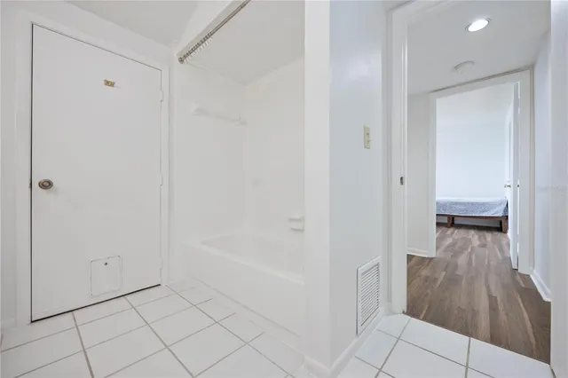 a view of a bathroom with sink and bathtub