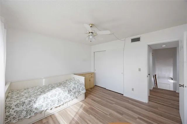 a bedroom with a bed and a walk in closet