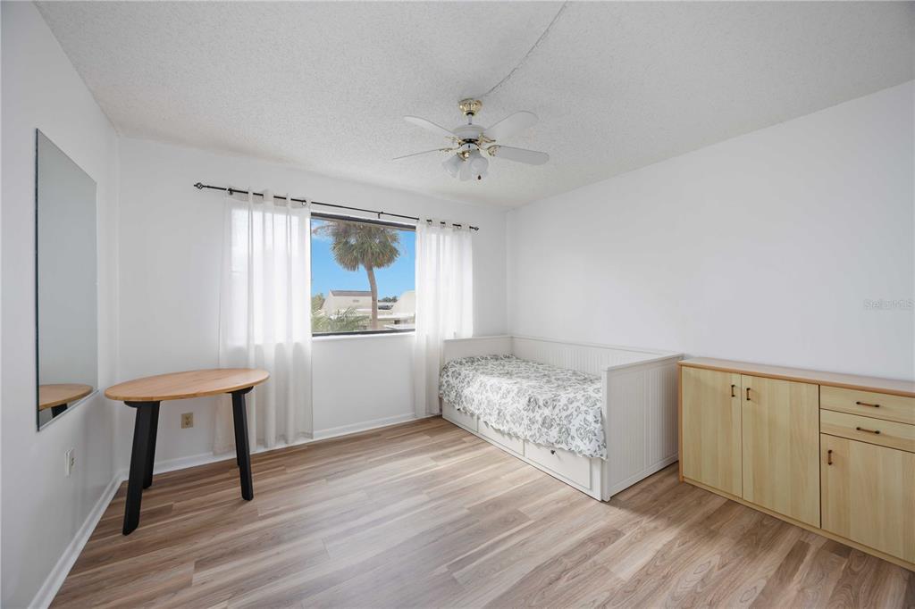 2767 Horseshoe Court, Unit Q3 Sarasota, FL 34235 - Photo 33 of 49 a view of a kitchen with wooden floor and a window