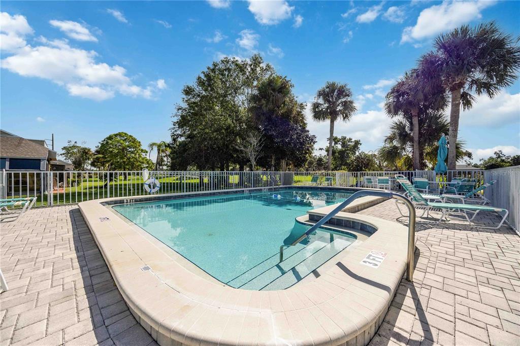2767 Horseshoe Court, Unit Q3 Sarasota, FL 34235 - Photo 38 of 49 a view of a swimming pool with a terrace