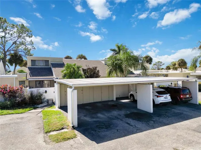 a view of house with outdoor space and sitting area