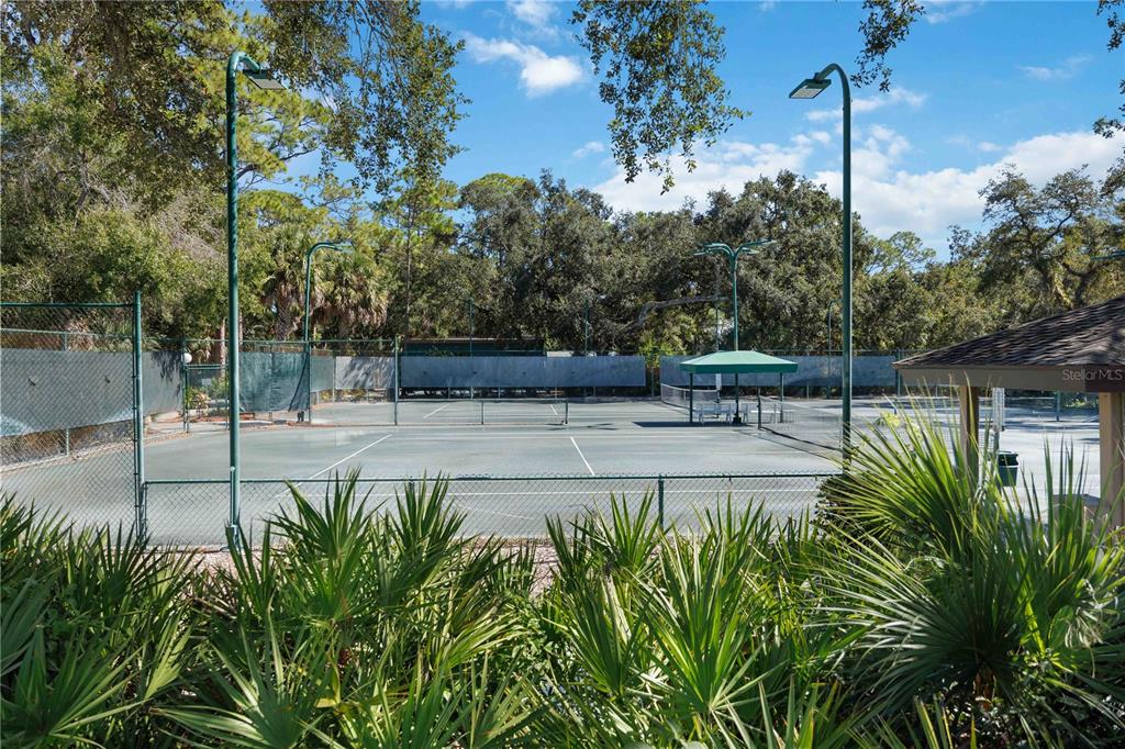 2767 Horseshoe Court, Unit Q3 Sarasota, FL 34235 - Photo 42 of 49 a view of a bench in the patio