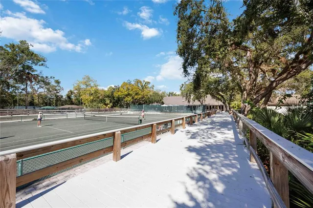 a view of a balcony with trees