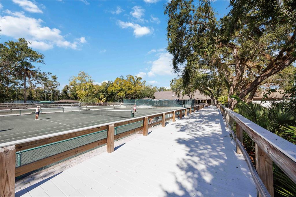 2767 Horseshoe Court, Unit Q3 Sarasota, FL 34235 - Photo 45 of 49 a view of a balcony with trees