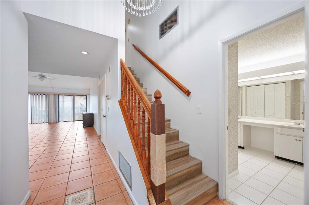 2767 Horseshoe Court, Unit Q3 Sarasota, FL 34235 - Photo 6 of 49 a view of entryway and hall with wooden floor