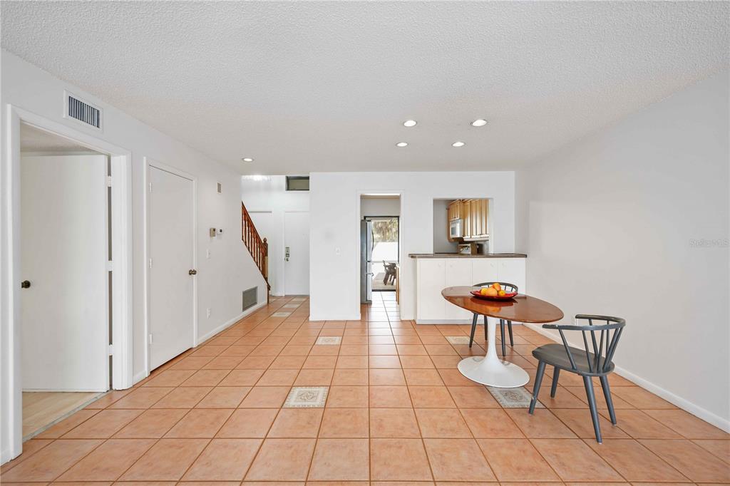 2767 Horseshoe Court, Unit Q3 Sarasota, FL 34235 - Photo 8 of 49 a living room with furniture and a wooden floor