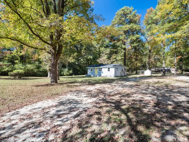 a house with trees in the background