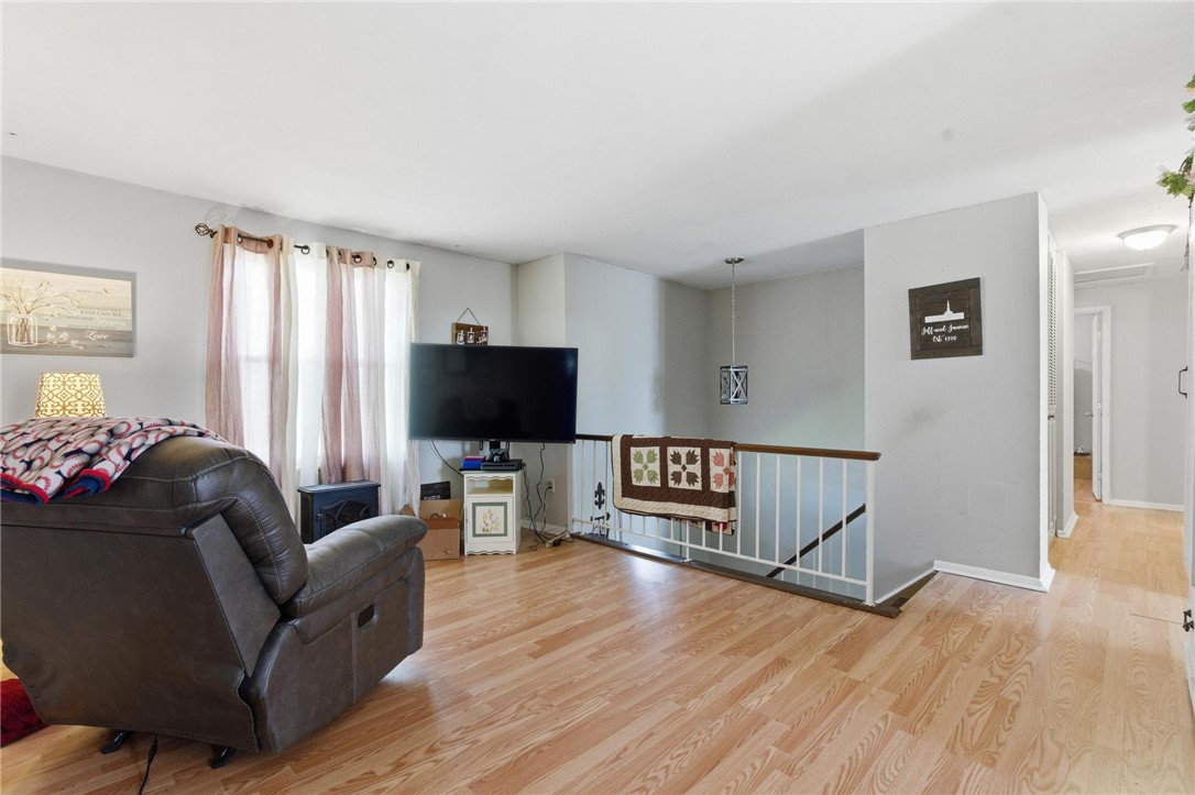 707 West Martindale Road Union, OH 45322 - Photo 3 of 28 This inviting living room features warm hardwood flooring, creating a comfortable atmosphere for everyday living.