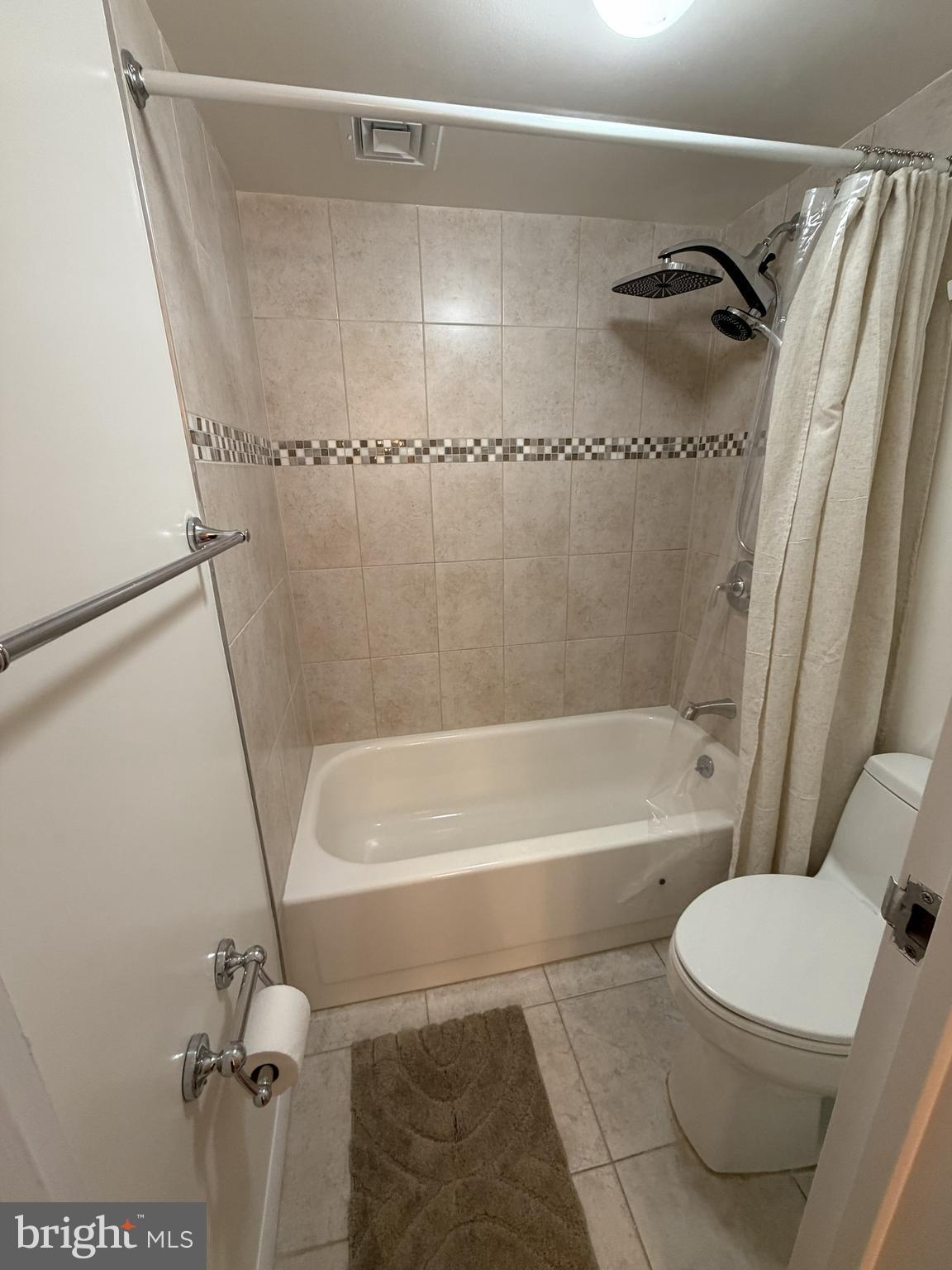 6800 Fleetwood Road, Unit 1002 McLean, VA 22101 - Photo 15 of 22 a bathroom with a toilet and a shower