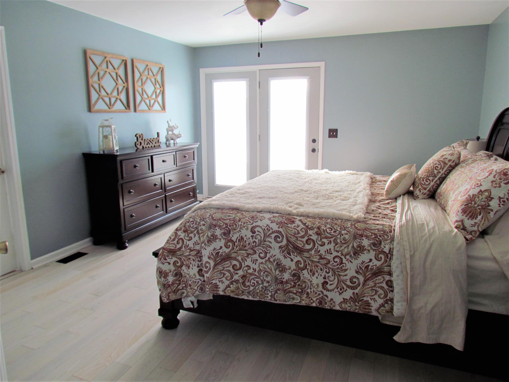 187 Coleman Road Readyville, TN 37149 - Photo 7 of 30 The master bedroom has a walk in closet, ceiling fan and an exterior door leading to the back patio