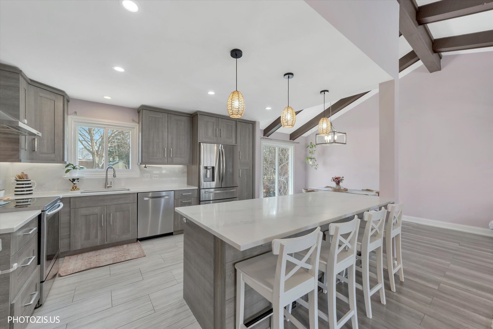 981 North Mill Road Addison, IL 60101 - Photo 14 of 41 a kitchen with a table and chairs in it