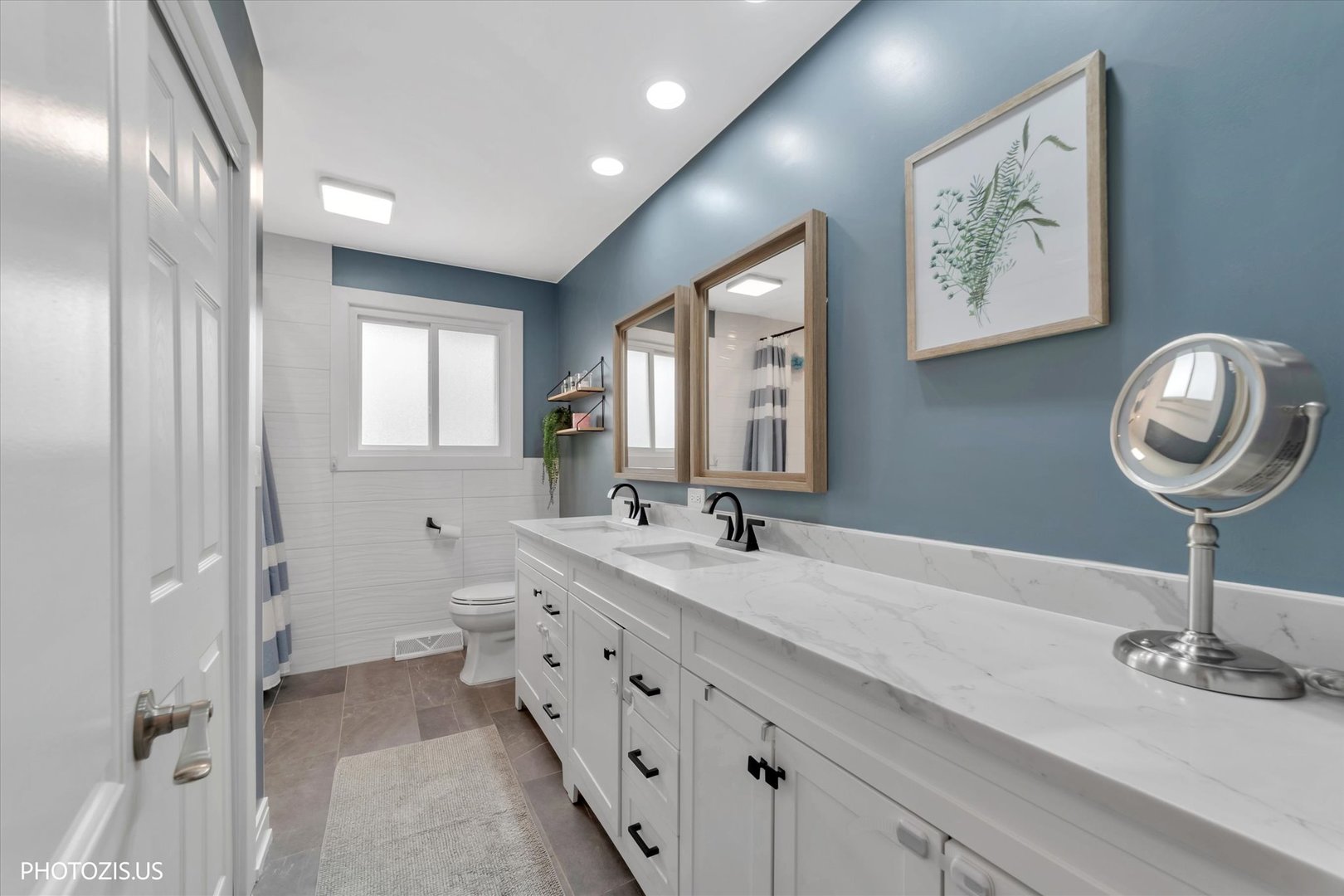 981 North Mill Road Addison, IL 60101 - Photo 16 of 41 a spacious bathroom with a double vanity sink and a mirror