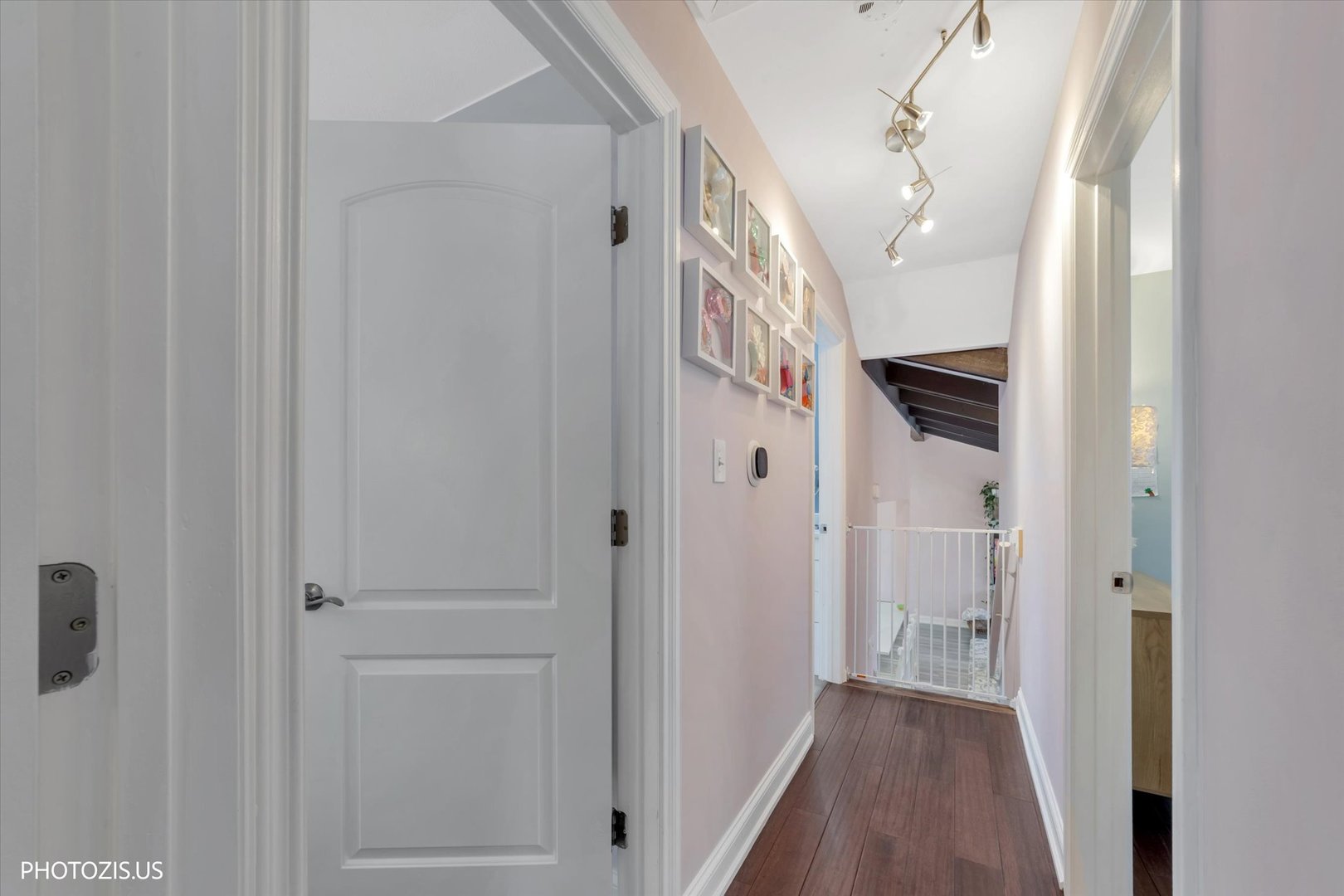 981 North Mill Road Addison, IL 60101 - Photo 19 of 41 a view of a hallway with a white walls and stairs